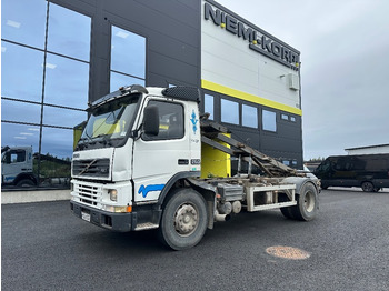 Skip loader truck VOLVO FM7