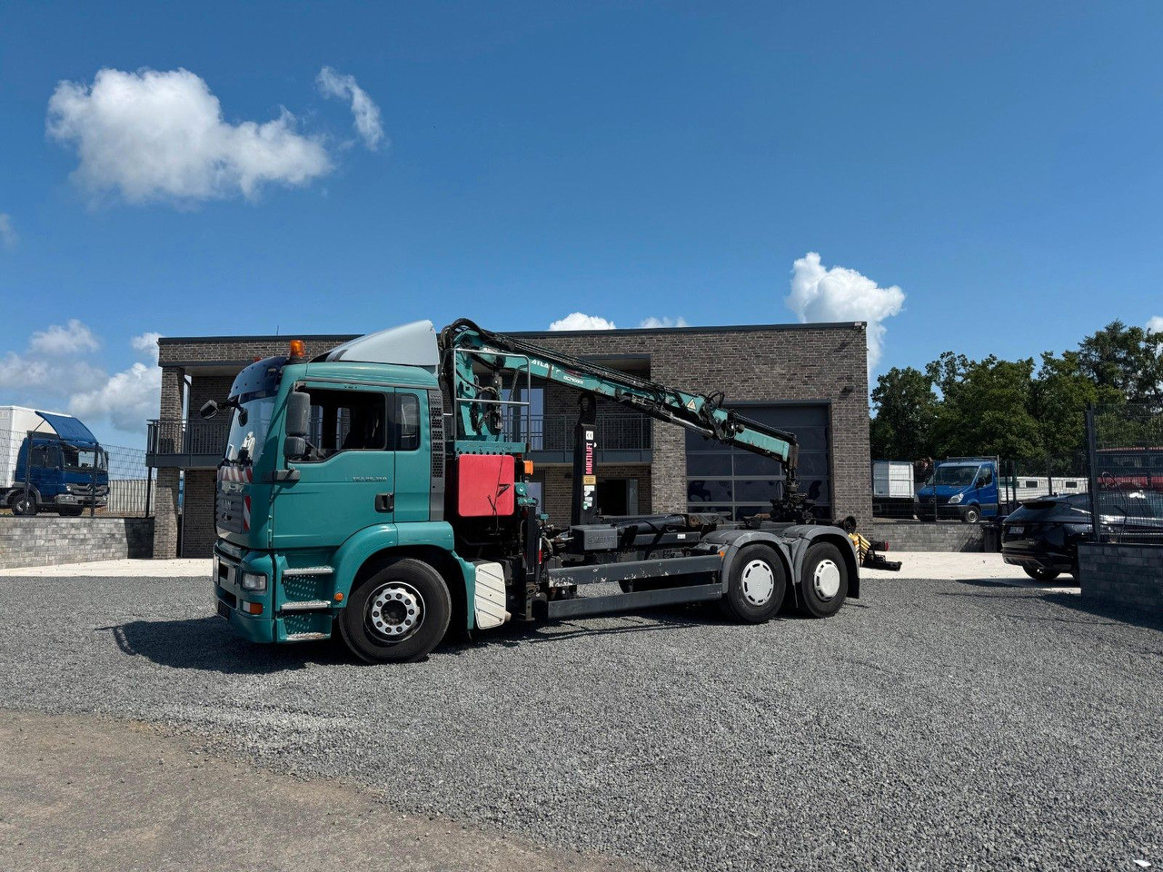 MAN TGA 26.360 Kran TeRex Multilift Fernbedienung - Hook lift truck, Crane truck: picture 1 MAN TGA 26.360 Kran TeRex Multilift Fernbedienung - Hook lift truck, Crane truck: picture 1