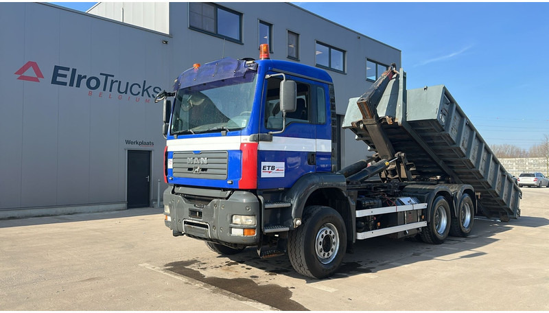 MAN TGA 26.460 (WITH CONTAINER / BELGIAN TRUCK / PERFECT / 6X4 / MANUAL GEARBOX / BOITE MANUELLE) - Hook lift truck: picture 1 MAN TGA 26.460 (WITH CONTAINER / BELGIAN TRUCK / PERFECT / 6X4 / MANUAL GEARBOX / BOITE MANUELLE) - Hook lift truck: picture 1