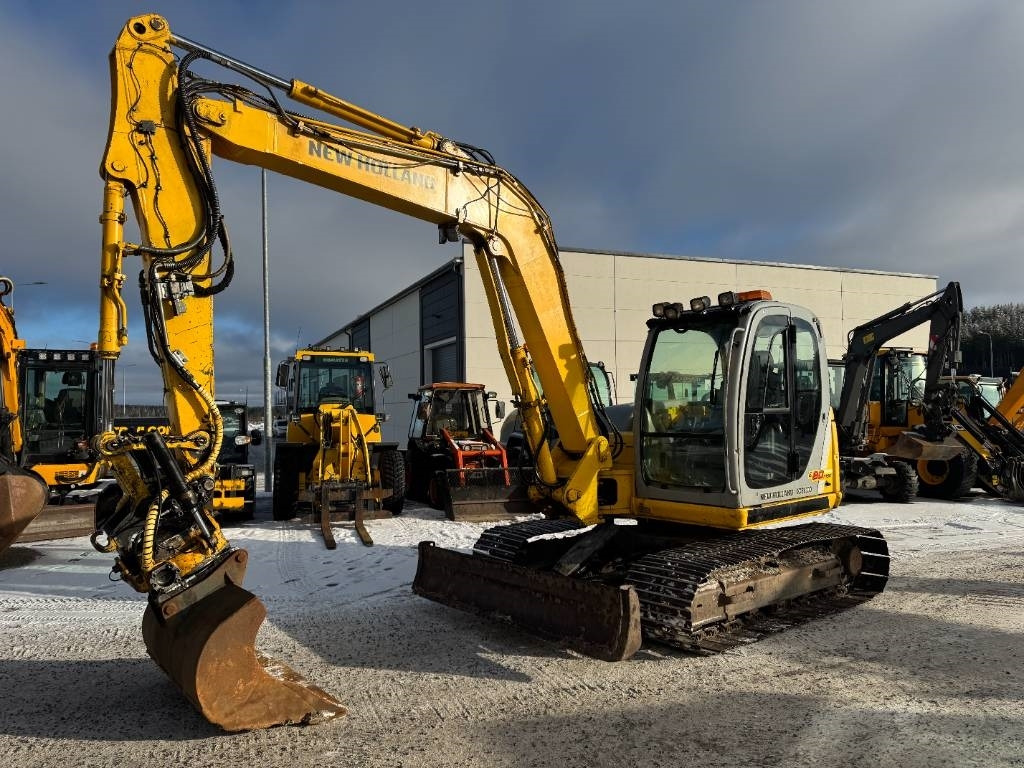 New Holland MYYTY! SOLD! E80MSR PYÖRITTÄJÄLLÄ - Mini excavator: picture 2 New Holland MYYTY! SOLD! E80MSR PYÖRITTÄJÄLLÄ - Mini excavator: picture 2