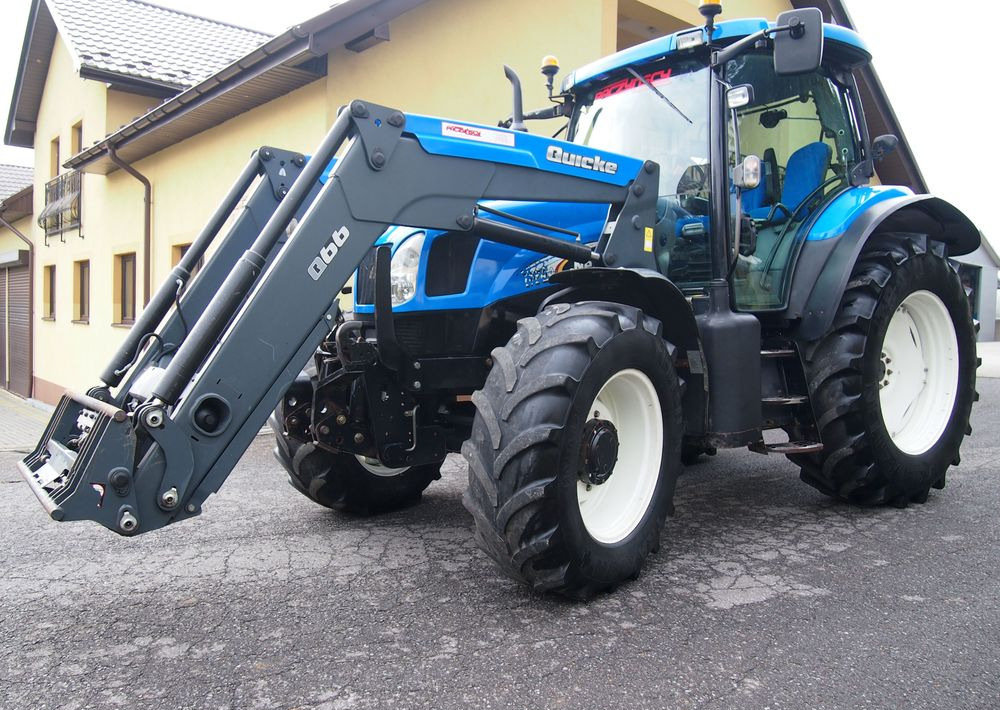 Ciągnik New Holland NH TS125A 6 cylindrów 2004 Ciągnik rolniczy New Holland TS125A - Farm tractor: picture 1 Ciągnik New Holland NH TS125A 6 cylindrów 2004 Ciągnik rolniczy New Holland TS125A - Farm tractor: picture 1