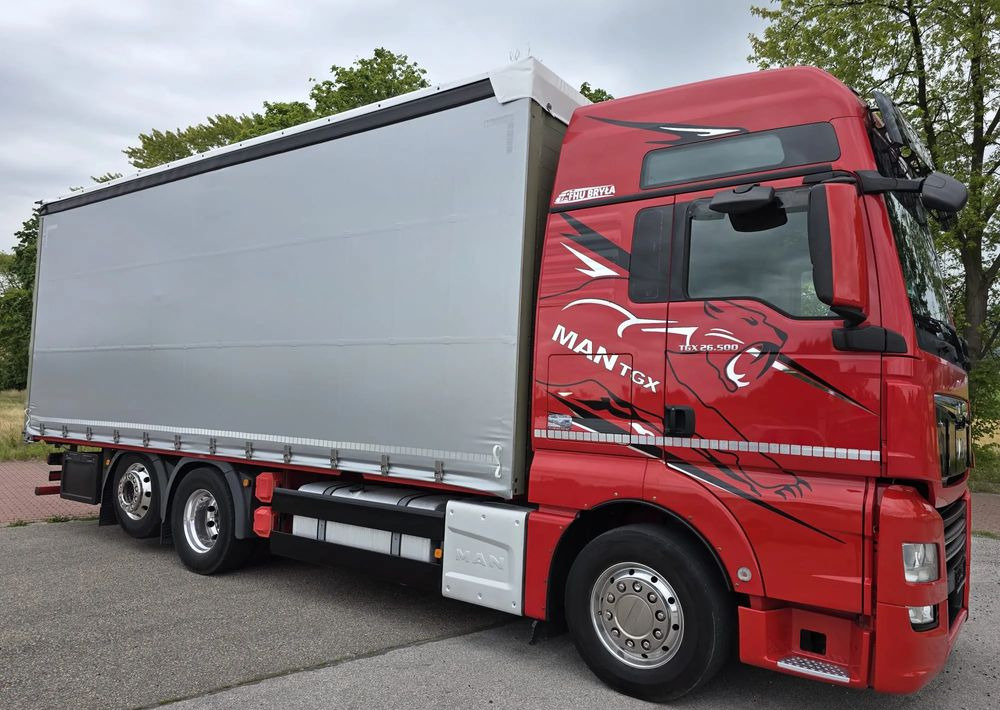 MAN TGX 26.500 / ALUMINIOWE FELGI / LIFT / 6X2 / KLIMA POSTOJOWA / 18PALET / E6 / FIRANKA / 17 TON ŁADOWNOŚĆ / WINDA / NISKI PRZEBIEG / JEDEN WŁAŚCICIEL / PODWIESZANA OŚ - Curtainsider truck: picture 1 MAN TGX 26.500 / ALUMINIOWE FELGI / LIFT / 6X2 / KLIMA POSTOJOWA / 18PALET / E6 / FIRANKA / 17 TON ŁADOWNOŚĆ / WINDA / NISKI PRZEBIEG / JEDEN WŁAŚCICIEL / PODWIESZANA OŚ - Curtainsider truck: picture 1