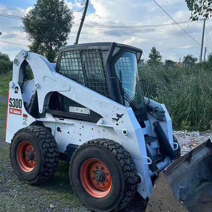 Used Bob Cat Bob Cat S300 Used Mini Skid Steer Wheel Loader Multifunctional Track Loaders Bobcat S300 - Skid steer loader: picture 1 Used Bob Cat Bob Cat S300 Used Mini Skid Steer Wheel Loader Multifunctional Track Loaders Bobcat S300 - Skid steer loader: picture 1
