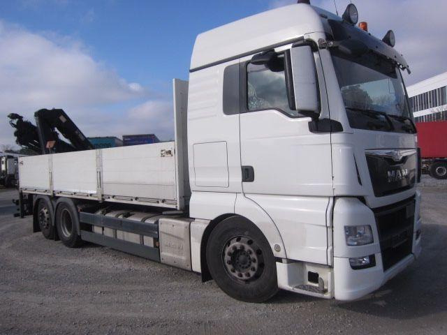 MAN TGX 26.440 mit Hiab-Kran Funkfernbedienung - Dropside/ Flatbed truck, Crane truck: picture 1 MAN TGX 26.440 mit Hiab-Kran Funkfernbedienung - Dropside/ Flatbed truck, Crane truck: picture 1